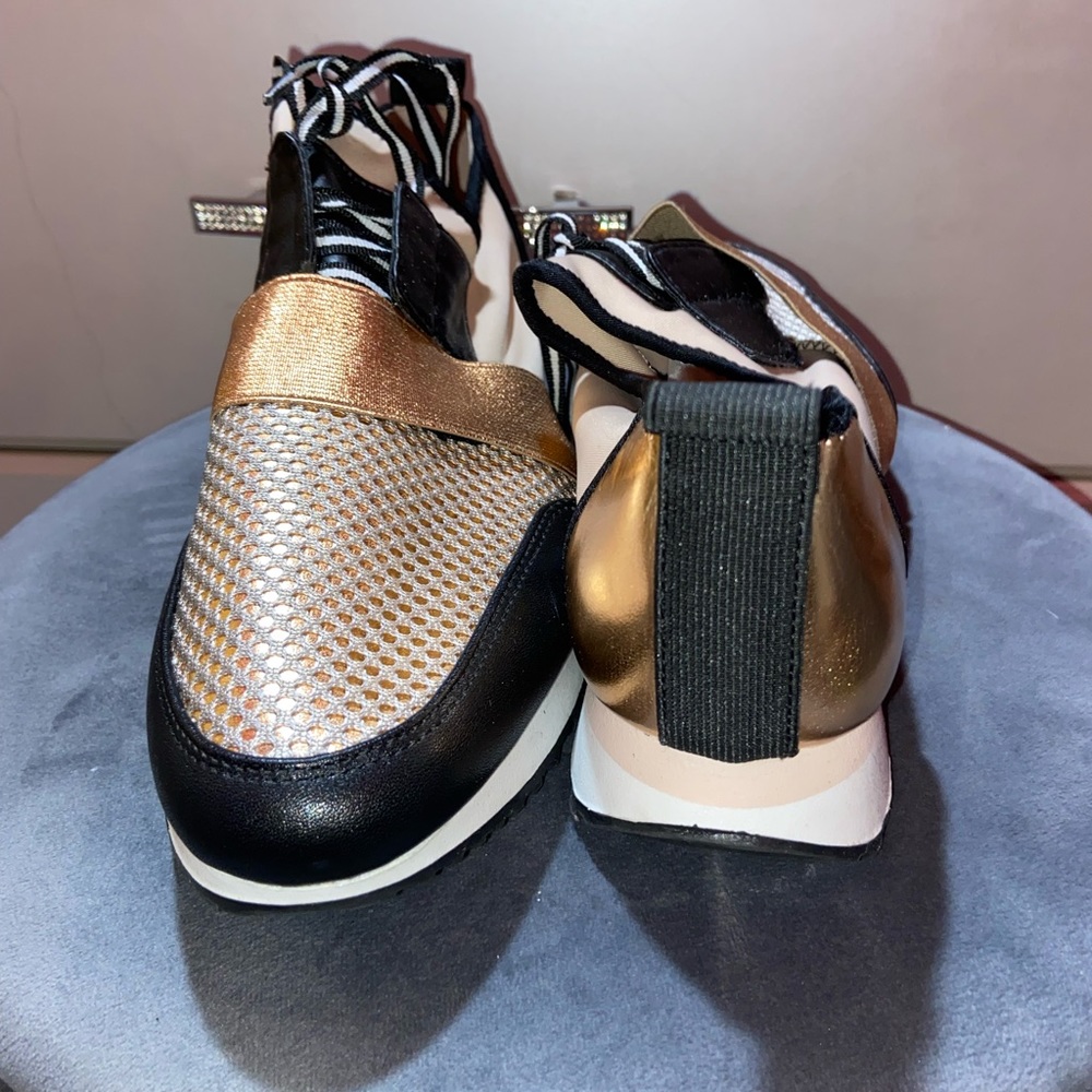 Steve madden with a  rose gold tint to it shoes
